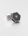 This is an urban and industrial design employing the hexagon shape and adding signature Tateossian texture with translucent and opaque enamel detailing. There is one round crystal from the SWAROVSKI ELEMENTS range set into the enamel surface to add a flash of light.Sold separatelyRhodium platedEnamel trimMade in United Kingdom