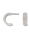 Covered in glittering pave crystals, Swarovski's huggie hoop earrings are a chic, classic look that's versatile enough to take you from the office to a night on the town! Set in silver tone mixed metal. Approximate diameter: 1/2 inch.