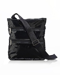 Coated durable ripstop nylon crossbody bag with single adjustable shoulder strap. Two front exterior zip pockets. Top zip closure. Lined. Coated durable ripstop nylon crossbody bag with single adjustable shoulder strap. Two front exterior zip pockets. Top zip closure. Lined.