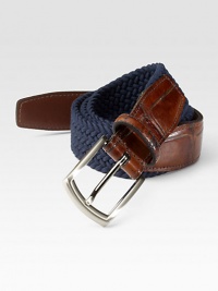 EXCLUSIVELY OURS. Superior stretch and casual comfort in a woven elastic style with alligator-embossed leather trim. Satin nickel buckle About 1¼ wide Made in USA