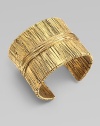 Richly textured with an organic look, this golden cuff has the sculptural appearance of wrapped and tied threads.GoldplatedDiameter, about 2¼Width, about 2Made in France