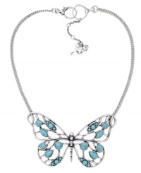 Spread your wings. Fossil's stylish large vintage openwork butterfly features resin and reconstituted turquoise, set in silver tone mixed metal. Approximate length: 13 inches + 2-inch extender. Approximate drop: 2-1/3 inches. Spread your wings. Fossil's stylish large vintage openwork butterfly features resin and reconstituted turquoise, set in silver tone mixed metal. Approximate length: 13 inches + 2-inch extender. Approximate drop: 2-1/3 inches.