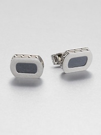 From the Batu Bedeg Collection. In a curved rectangular shape, this stunning design combines panels of sleek hematine with a carved setting of sterling silver.HematineSterling silverSwivel backMade in Bali From the Batu Bedeg Collection. In a curved rectangular shape, this stunning design combines panels of sleek hematine with a carved setting of sterling silver.HematineSterling silverSwivel backMade in Bali
