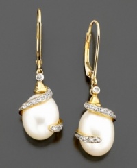 Sophisticated cultured freshwater pearls (11x9 mm) get a glamourous edge with elegant wrapped round-cut diamonds (1/10 ct. t.w.) set in 14k gold. Drop measures 1-/14 inch. Sophisticated cultured freshwater pearls (11x9 mm) get a glamourous edge with elegant wrapped round-cut diamonds (1/10 ct. t.w.) set in 14k gold. Drop measures 1-/14 inch.