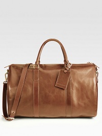 For the gentleman who prefers to travel in style, this sophisticated duffel crafted in calfskin leather features a a removable shoulder strap, an interior pocket and a luggage tag.Zip closureDouble top handlesRemovable shoulder strapLeather20W x 11H x 9DImported For the gentleman who prefers to travel in style, this sophisticated duffel crafted in calfskin leather features a a removable shoulder strap, an interior pocket and a luggage tag.Zip closureDouble top handlesRemovable shoulder strapLeather20W x 11H x 9DImported