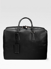 An elegant travel tote in saffiano leather with a full-zip closure and straps inside. Zip closure Top handles ID tag 20W X 14H X 7D Made in Italy An elegant travel tote in saffiano leather with a full-zip closure and straps inside. Zip closure Top handles ID tag 20W X 14H X 7D Made in Italy