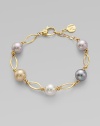 A gorgeous blend of different colored pearls with 18k goldplated sterling silver links. 10mm and 12mm round white, champagne, grey and black organic hand-made pearls 18k goldplated sterling silver Lobster clasp closure Length, about 7½ Imported 