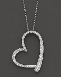 Diamonds gleam from a 14K white gold heart pendant. Diamonds gleam from a 14K white gold heart pendant.