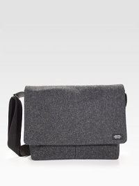 Sturdy and sleek in durable, water resistant waxed wool, detailed with leather trim and custom die-cast black hardware.Adjustable shoulder strapFlap closureLaptop interior pocket with tab closureOrganizing pocketsInterior zipper pocketsCotton liningWaxed wool exterior14 X 14 X 3Imported Sturdy and sleek in durable, water resistant waxed wool, detailed with leather trim and custom die-cast black hardware.Adjustable shoulder strapFlap closureLaptop interior pocket with tab closureOrganizing pocketsInterior zipper pocketsCotton liningWaxed wool exterior14 X 14 X 3Imported