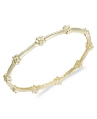 The perfect gift for a little princess. This flower-accented bangle bracelet shines in 18k gold over sterling silver. Approximate diameter: 2 inches. The perfect gift for a little princess. This flower-accented bangle bracelet shines in 18k gold over sterling silver. Approximate diameter: 2 inches.