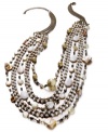 Drape yourself in the seaside hues of summer. Style&co.'s exotic layered style features shimmering shells and polished plastic beads in gold tone mixed metal. Approximate length: 14 inches + 3-inch extender. Approximate drop: 3 inches.