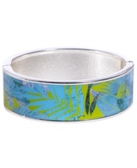 Channel the exoticism and energy of Brasil in Haskell's inspired skinny bangle. The Palm bangle features a blue and green palm leaf print design, set in silver tone mixed metal with a hinge clasp. Approximate diameter: 2-1/2 inches. Approximate length: 8 inches. Item comes packaged in a green gift box. Channel the exoticism and energy of Brasil in Haskell's inspired skinny bangle. The Palm bangle features a blue and green palm leaf print design, set in silver tone mixed metal with a hinge clasp. Approximate diameter: 2-1/2 inches. Approximate length: 8 inches. Item comes packaged in a green gift box.