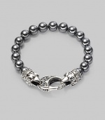 A new look for the modern man, handsomely crafted with a sterling silver raven's head clasp and a string of hematite beads. Sterling silver 10mm hematite beads Lobster clasp closure Bracelet, 9 long Imported 