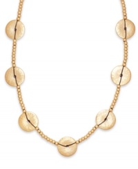 Elaborately embellished. A chic combination of hammered disks and rondelle beading adorn this eye-catching cord necklace from Lauren by Ralph Lauren. Crafted in gold tone mixed metal. Approximate length: 36 inches. Elaborately embellished. A chic combination of hammered disks and rondelle beading adorn this eye-catching cord necklace from Lauren by Ralph Lauren. Crafted in gold tone mixed metal. Approximate length: 36 inches.