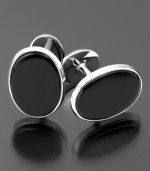 Pay attention to every detail. The handsome cufflinks feature onyx (9 x 7 mm) set in sterling silver.