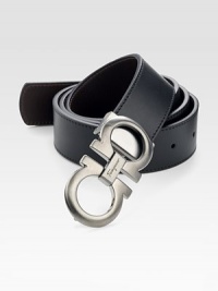 Black on one side and hickory on the other, this reversible belt crafted in smooth Italian leather with double gancini buckle, will be a stylish, versatile addition to your existing wardrobe.LeatherAbout 1½ wideMade in Italy Black on one side and hickory on the other, this reversible belt crafted in smooth Italian leather with double gancini buckle, will be a stylish, versatile addition to your existing wardrobe.LeatherAbout 1½ wideMade in Italy