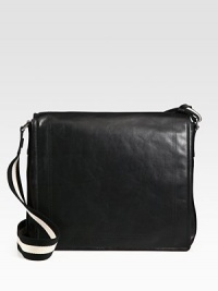 Simple, sleek design in calfskin leather is completed with a full flap closure and iconic trainspotting web shoulder strap detail.Flap closureAdjustable shoulder strapInterior pocketsFully lined15W x 13H x 4DMade in Switzerland Simple, sleek design in calfskin leather is completed with a full flap closure and iconic trainspotting web shoulder strap detail.Flap closureAdjustable shoulder strapInterior pocketsFully lined15W x 13H x 4DMade in Switzerland