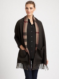 Reverses from solid to a bold check pattern with fringe trim on luxurious cashmere.Cashmere74 X 15Dry cleanImported Reverses from solid to a bold check pattern with fringe trim on luxurious cashmere.Cashmere74 X 15Dry cleanImported