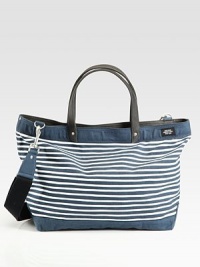 Constructed in durable waxed cotton and canvas, this rugged carryall is the perfect tote for your workday necessities or a trip to the gym.Double top handlesFlap with buckle closuresAdjustable shoulder strapInterior zip pocketWaxed cotton and canvas13¾W X 15½H X 6DImported Constructed in durable waxed cotton and canvas, this rugged carryall is the perfect tote for your workday necessities or a trip to the gym.Double top handlesFlap with buckle closuresAdjustable shoulder strapInterior zip pocketWaxed cotton and canvas13¾W X 15½H X 6DImported