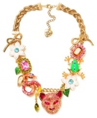 Turn on the charm with this funky frontal necklace from Betsey Johnson. Fabulously flaunts gold tone bows, tiger accented with pink-colored crystals, green frog with blue-colored crystals, pink and orange rectangular gems with crystal accents, green and gold tone leaves, snake with crystal accents and white flowers with crystal accents. Crafted in gold-plated mixed metal. Approximate length: 18 inches + 3-inch extender. Approximate drop: 1-3/4 inches. Turn on the charm with this funky frontal necklace from Betsey Johnson. Fabulously flaunts gold tone bows, tiger accented with pink-colored crystals, green frog with blue-colored crystals, pink and orange rectangular gems with crystal accents, green and gold tone leaves, snake with crystal accents and white flowers with crystal accents. Crafted in gold-plated mixed metal. Approximate length: 18 inches + 3-inch extender. Approximate drop: 1-3/4 inches.