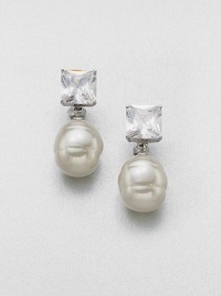 A simple and elegant design featuring a lustrous pearl accented with a brilliant crystal. 14mm round white organic man-made pearlCrystalsSterling silverSize, about 2Post clip backImported A simple and elegant design featuring a lustrous pearl accented with a brilliant crystal. 14mm round white organic man-made pearlCrystalsSterling silverSize, about 2Post clip backImported