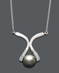Elegance at its finest. This intricate pendant features a unique 14k white gold setting cradling a cultured Tahitian pearl (8-9 mm). Sides dusted by round-cut diamond accents. Approximate length: 16 inches. Approximate drop: 1 inch. Elegance at its finest. This intricate pendant features a unique 14k white gold setting cradling a cultured Tahitian pearl (8-9 mm). Sides dusted by round-cut diamond accents. Approximate length: 16 inches. Approximate drop: 1 inch.