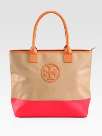 This sophisticated, colorblocked coated canvas design features supple leather trim and a signature logo emblem.Leather double shoulder straps, 7½ dropTop zip closureOne inside zip pocketTwo inside open pocketsCanvas lining13W X 12¼H X 5DImported This sophisticated, colorblocked coated canvas design features supple leather trim and a signature logo emblem.Leather double shoulder straps, 7½ dropTop zip closureOne inside zip pocketTwo inside open pocketsCanvas lining13W X 12¼H X 5DImported