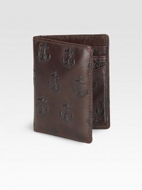 Vegetable-dyed cowhide embossed with a repeat burnished anchor and lined with screenprinted linen. Two slip pockets Six card sleeves 3¼W X 4H Imported Vegetable-dyed cowhide embossed with a repeat burnished anchor and lined with screenprinted linen. Two slip pockets Six card sleeves 3¼W X 4H Imported