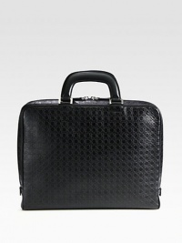 Single gusset briefcase crafted from gancini stamped calfskin leather featuring a removable, inside computer pocket to secure your investment in style.Zip closureDouble top handlesInterior pocketsLeather15W x 11H x 2DMade in Italy