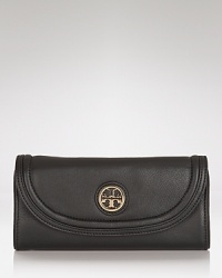 Tory Burch adds some attitude to the every day accessories with this leather wallet. The chic envelope design cleverly disguises multiple pockets which are perfect for keeping the essentials pretty organized. Tory Burch adds some attitude to the every day accessories with this leather wallet. The chic envelope design cleverly disguises multiple pockets which are perfect for keeping the essentials pretty organized.