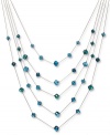 Find a colorful new level of style. This five-row illusion necklace by c.A.K.e by Ali Khan boasts turquoise-colored glass beads (10-12 mm). Set in gold tone mixed metal. Approximate length: 17 inches + 3-inch extender. Approximate drop: 6 inches.