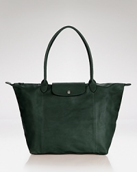 This season, Longchamp gives its signature Le Pliage bag a luxe update. Now in incredibly soft leather, it's a rich take on the practical style you need (and love). This season, Longchamp gives its signature Le Pliage bag a luxe update. Now in incredibly soft leather, it's a rich take on the practical style you need (and love).