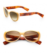 Flashback to the 50's with these small cat's-eye sunglasses in lightweight acetate with logo temples. Available in havana with brown gradient lens or beige with gray lens.Plastic logo temples100% UV protectionMade in Italy