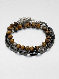 This chain link and beaded, multi-row design of stainless steel and sterling silver is embellished with tiger's eye beading for a colorful, charismatic look.Stainless steel/sterling silverTiger's eyeAbout 3 diam.Imported This chain link and beaded, multi-row design of stainless steel and sterling silver is embellished with tiger's eye beading for a colorful, charismatic look.Stainless steel/sterling silverTiger's eyeAbout 3 diam.Imported