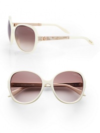 Chic round style with python printed leather accented temples on a lightweight, plastic frame. Available in ivory/rose python/rose gold with brown gradient lens. Python printed leather and logo accented temples100% UV protectionMade in Italy Chic round style with python printed leather accented temples on a lightweight, plastic frame. Available in ivory/rose python/rose gold with brown gradient lens. Python printed leather and logo accented temples100% UV protectionMade in Italy