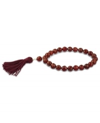 Totally on trend! Tassels are the thing this season, and this crimson-colored tassel and carnelian bead bracelet (109-3/8 ct. t.w.) completes the look. Set in 18k gold over sterling silver. Bracelet stretches to fit wrist. Approximate diameter: 2-1/4 inches. Approximate length: 7-1/2 inches. Totally on trend! Tassels are the thing this season, and this crimson-colored tassel and carnelian bead bracelet (109-3/8 ct. t.w.) completes the look. Set in 18k gold over sterling silver. Bracelet stretches to fit wrist. Approximate diameter: 2-1/4 inches. Approximate length: 7-1/2 inches.