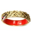 Red alert! A striking scarlet interior makes a very vibrant statement on this chic bangle bracelet from RACHEL Rachel Roy. Embellished by a crisscross textured surface and a lock with red lips, it's made in gold tone mixed metal. Approximate diameter: 2-1/2 inches.