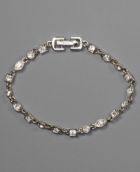 A stunning bracelet with crystal accents in an array of shapes, by Givenchy. Set in silvertone mixed metal. Approximate length: 7-1/4 inches. A stunning bracelet with crystal accents in an array of shapes, by Givenchy. Set in silvertone mixed metal. Approximate length: 7-1/4 inches.