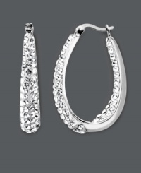 Celebrity-inspired style that will have you looking red-carpet ready. These glamorous Kaleidoscope hoop earrings feature a sparkling in and out design accentuated by clear crystals with Swarovski Elements. Crafted in sterling silver. Approximate diameter: 1-1/10 inches. Celebrity-inspired style that will have you looking red-carpet ready. These glamorous Kaleidoscope hoop earrings feature a sparkling in and out design accentuated by clear crystals with Swarovski Elements. Crafted in sterling silver. Approximate diameter: 1-1/10 inches.