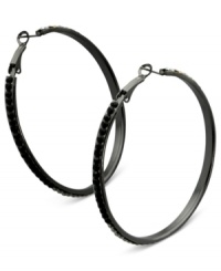 Luminous details take charge on these clutchless hoops from GUESS. Clear, black diamond, hematite and jet crystal stones adorn a classic earring silhouette. Crafted in hematite tone mixed metal. Approximate drop: 2-1/4 inches. Luminous details take charge on these clutchless hoops from GUESS. Clear, black diamond, hematite and jet crystal stones adorn a classic earring silhouette. Crafted in hematite tone mixed metal. Approximate drop: 2-1/4 inches.