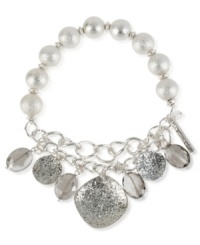 Take a shine to this half stretch bracelet from Kenneth Cole New York. Crafted from silver-tone mixed metal, glistening glass pearls and accents truly add luster to this piece. Item comes packaged in a signature Kenneth Cole New York Gift Box. Approximate diameter: 2-1/2 inches. Take a shine to this half stretch bracelet from Kenneth Cole New York. Crafted from silver-tone mixed metal, glistening glass pearls and accents truly add luster to this piece. Item comes packaged in a signature Kenneth Cole New York Gift Box. Approximate diameter: 2-1/2 inches.
