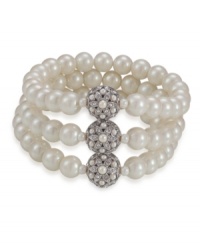 Add vintage glamour to an everyday look with this romantic bracelet by Carolee. Three rows of glass pearls secured by three medallions gleaming with crystal accents. Crafted in imitation rhodium-plated mixed metal. Stretches to fist wrist. Approximate diameter: 3-1/4 inches. Add vintage glamour to an everyday look with this romantic bracelet by Carolee. Three rows of glass pearls secured by three medallions gleaming with crystal accents. Crafted in imitation rhodium-plated mixed metal. Stretches to fist wrist. Approximate diameter: 3-1/4 inches.