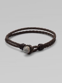 A subtle, yet striking design in woven leather with engraved black rhodium and rose gold bead detail.LeatherSterling silverToggle claspAbout 3½ diam.Imported A subtle, yet striking design in woven leather with engraved black rhodium and rose gold bead detail.LeatherSterling silverToggle claspAbout 3½ diam.Imported
