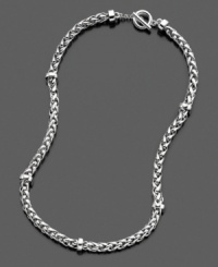 A cheerfully rustic sensibility shines from this beautifully braided, silvertone mixed metal necklace. Measures approximately 18 inches long.