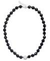 A traditional style with bold, modern appeal. This chunky strand necklace showcases faceted onyx beads (10 mm) and a sparkling crystal ball at center (12 mm). Clasp crafted in sterling silver. Approximate length: 18 inches + 1-inch extender.