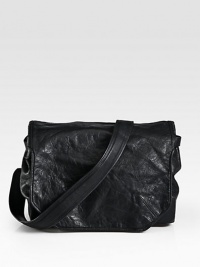 A signature messenger style exudes a sharp, metropolitan edge, crafted from waxed leather, with a buckle closure and interior zip compartments to secure all of your essentials.Flap, buckle closureAdjustable shoulder strapInterior zip pocketCotton liningLeather15W x 12H x 5DImported A signature messenger style exudes a sharp, metropolitan edge, crafted from waxed leather, with a buckle closure and interior zip compartments to secure all of your essentials.Flap, buckle closureAdjustable shoulder strapInterior zip pocketCotton liningLeather15W x 12H x 5DImported