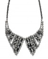 Bar III's extravagant collar necklace resembles, literally, a collar! Turn any look into a black tie-ready ensemble with the crystal details and unique hematite-plated mixed metal setting of this unusually-chic necklace. Approximate length: 20 inches + 3-inch extender. Approximate drop width: 4-1/4 inches. Approximate drop length: 4 inches.
