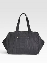 An oversized carryall ideal for a daytrip or an overnight jaunt, constructed in coated canvas and destined to last for years to come. Zip closure Covered logo plate Exterior zip pocket Interior slip pocket Fully lined 19¾W X 12H X 12D Imported An oversized carryall ideal for a daytrip or an overnight jaunt, constructed in coated canvas and destined to last for years to come. Zip closure Covered logo plate Exterior zip pocket Interior slip pocket Fully lined 19¾W X 12H X 12D Imported