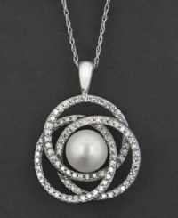 A soothing pattern of interlocking sparkling circles makes an eye-catching backdrop for a beautiful cultured freshwater pearl (7 mm). This pendant features round-cut diamonds (1/2 ct. t.w.) set in 14k white gold. Approximate length: 18 inches. Approximate drop: 1-1/4 inches. A soothing pattern of interlocking sparkling circles makes an eye-catching backdrop for a beautiful cultured freshwater pearl (7 mm). This pendant features round-cut diamonds (1/2 ct. t.w.) set in 14k white gold. Approximate length: 18 inches. Approximate drop: 1-1/4 inches.