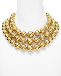 Layered strands of gleaming beads are a bold statement on this Michael Kors necklace which instantly transforms a basic neckline, finished by a turnlock closure. Layered strands of gleaming beads are a bold statement on this Michael Kors necklace which instantly transforms a basic neckline, finished by a turnlock closure.